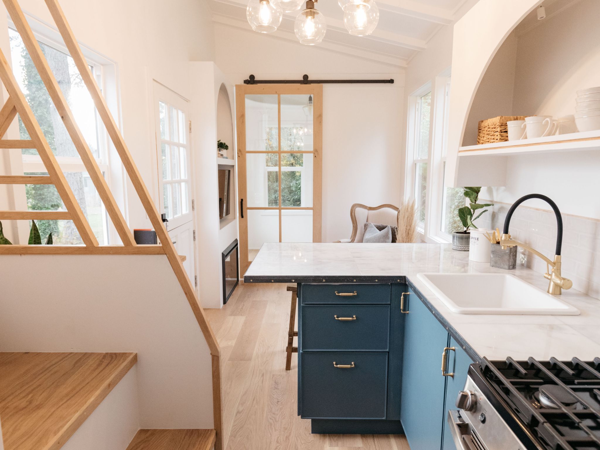Interior of a custom granny flat in Bundaberg showing a modern living area with furniture and natural light.
