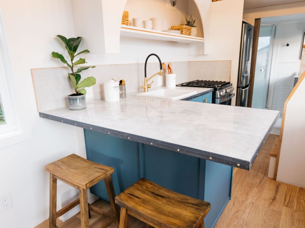 Interior of a prefab granny flat in Queensland featuring a compact, functional living space with stylish décor.